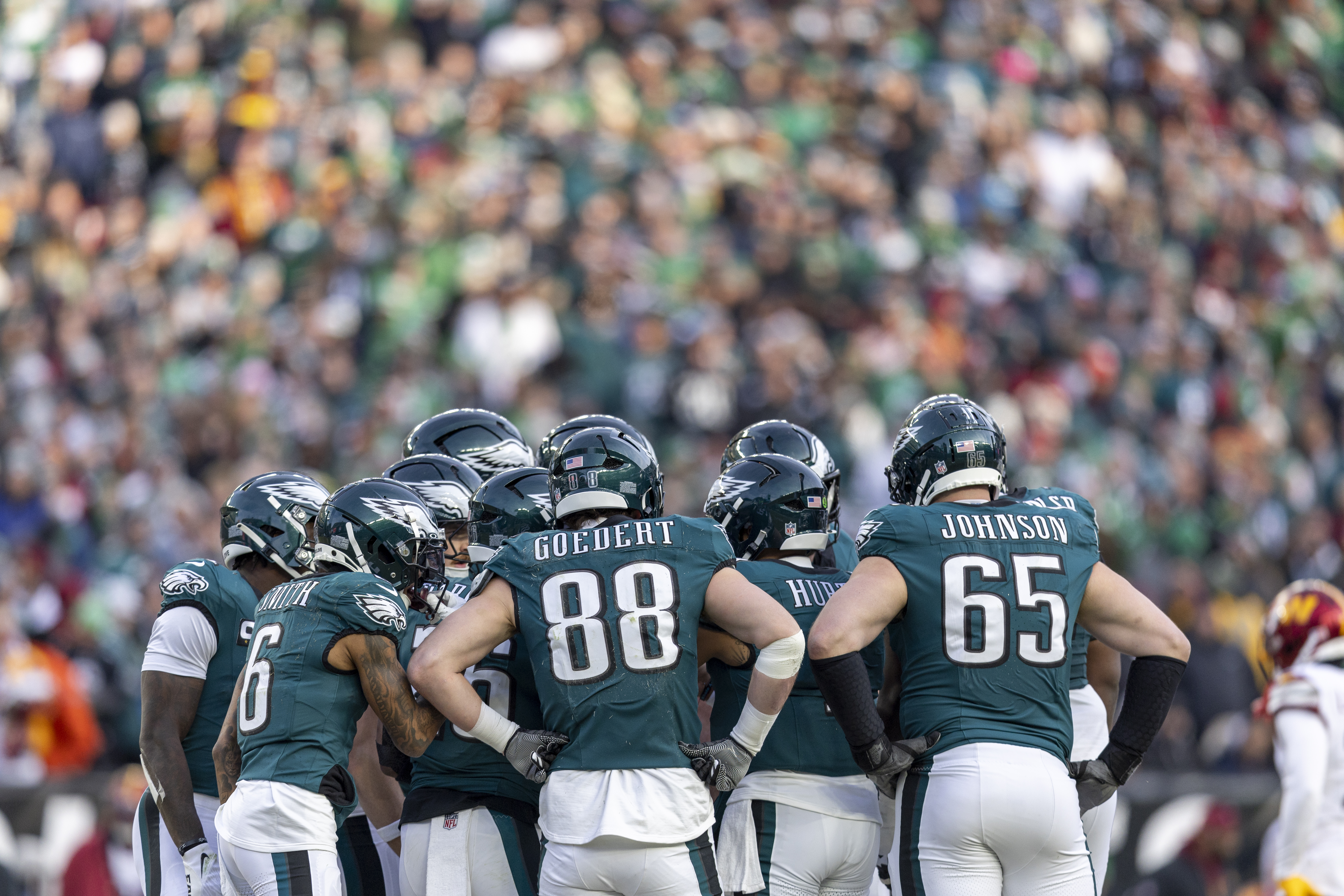 PHILADELPHIA, PENNSYLVANIA – JANUARY 26: Philadelphia Eagles huddle before a play during the games against Washington Commanders at Lincoln Financial Field on January 26, 2025 in Philadelphia, Pennsylvania. The Eagles beat the Commanders 55-23. (Photo by Lauren Leigh Bacho/Getty Images)